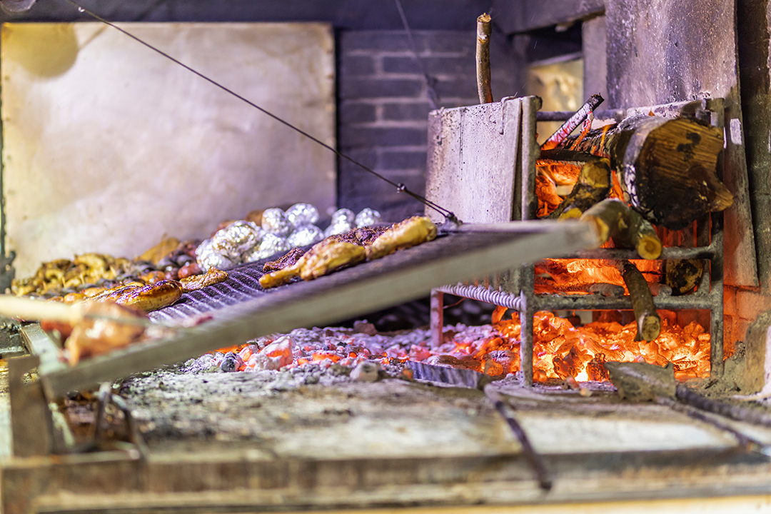 Open firepit with food grilling