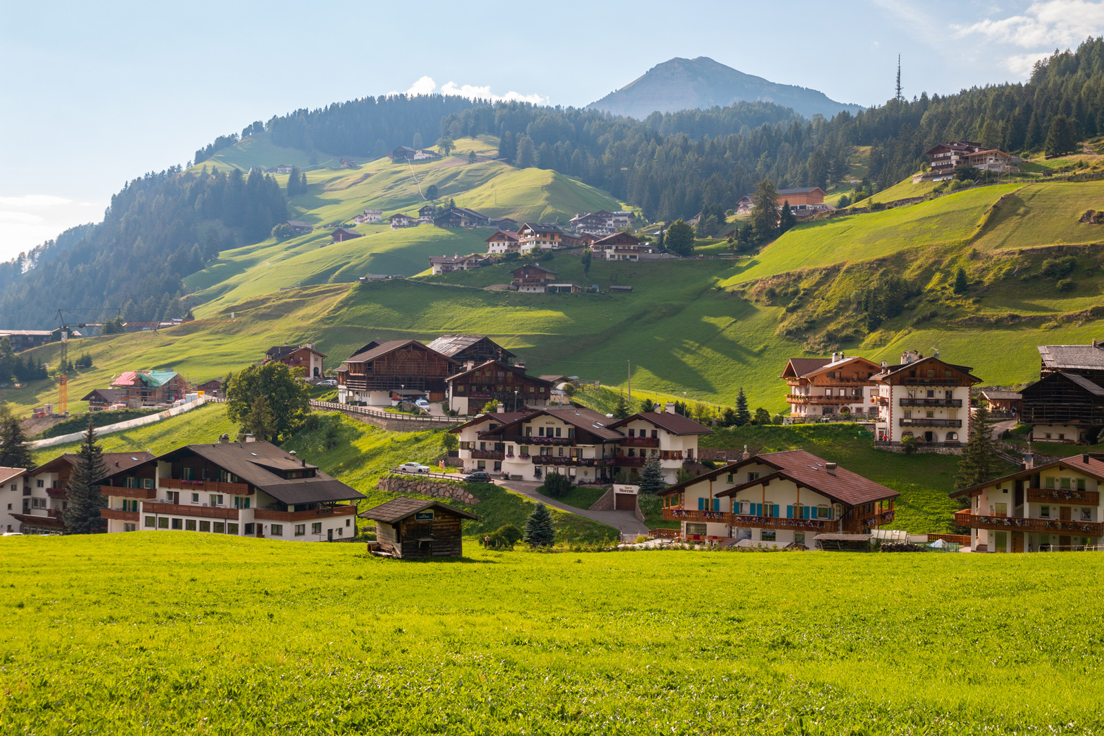 Wide view of a small town in the middle of a grassy valley