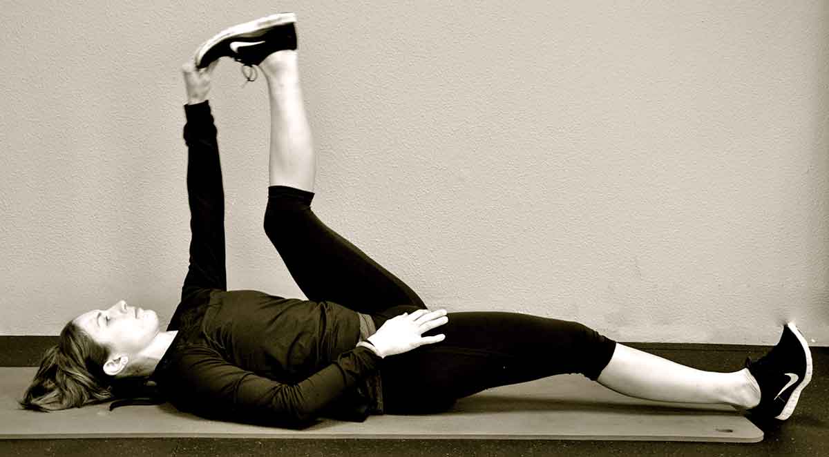 Yoga stretching pose, reclining head to toe