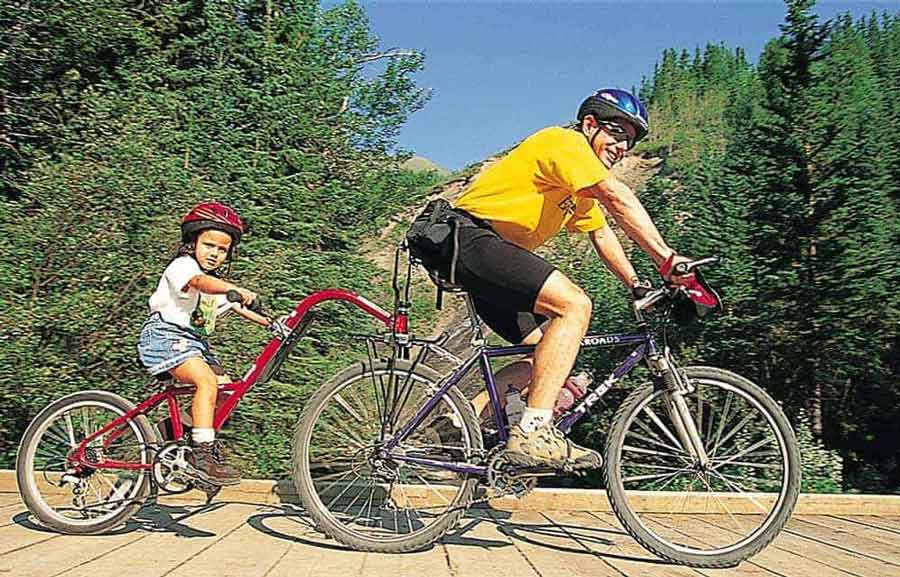 Backroads Founder Tom Hale family biking with a piccolo