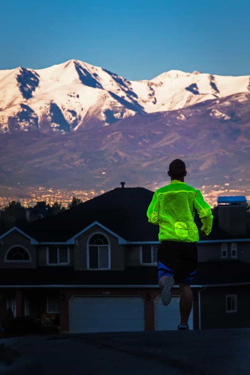 Backroads leader Dirk Badenhorst jogging with a bright and visible Patagonia widnshirt