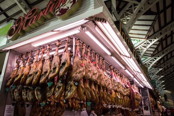 Ham legs hanging in shop