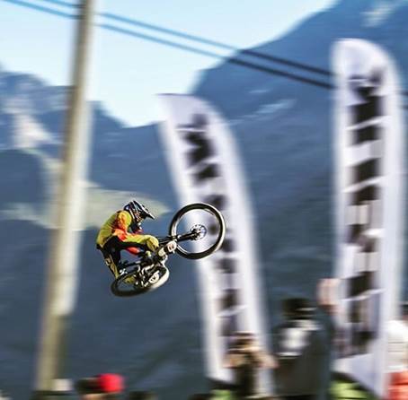 Finn Iles competes in a professional downhill mountain bike race