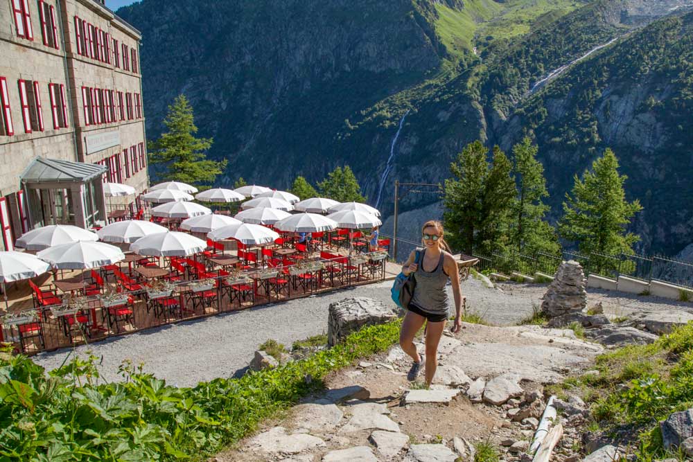 Backroads guest hiking at a historic hut in the Alps