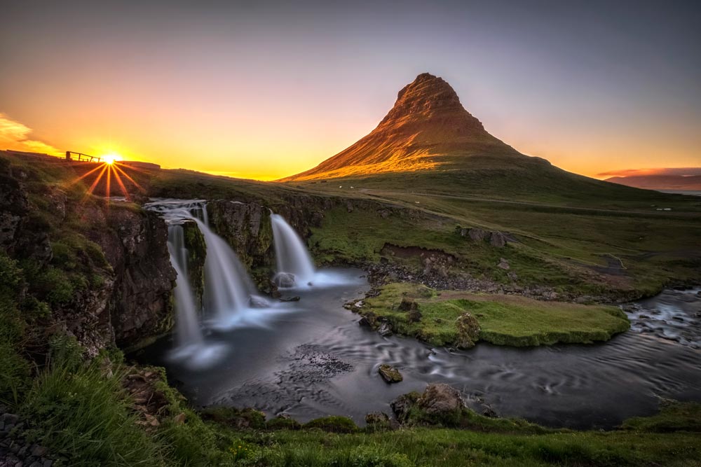 Midnight Sun in Iceland near Waterfall