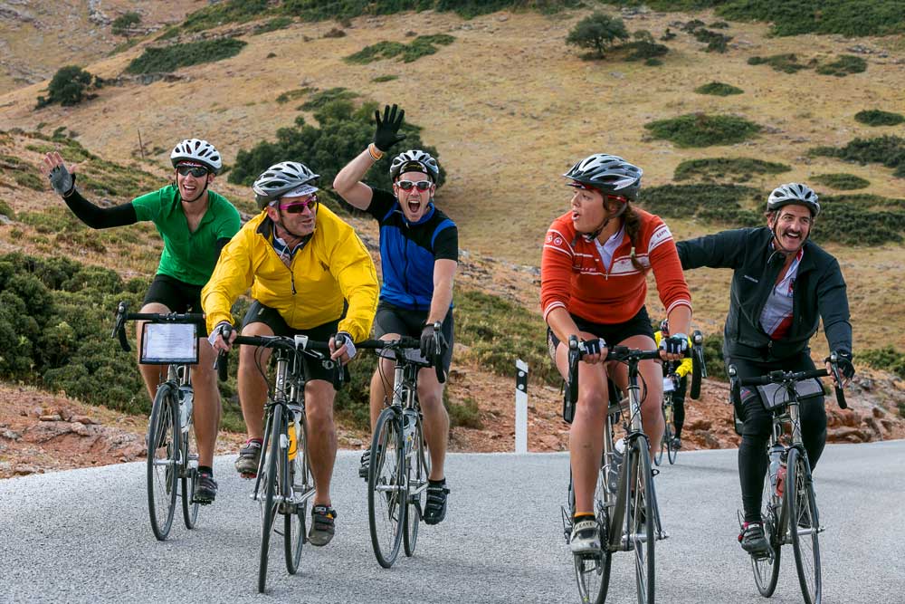 Friends riding bikes together with Backroads