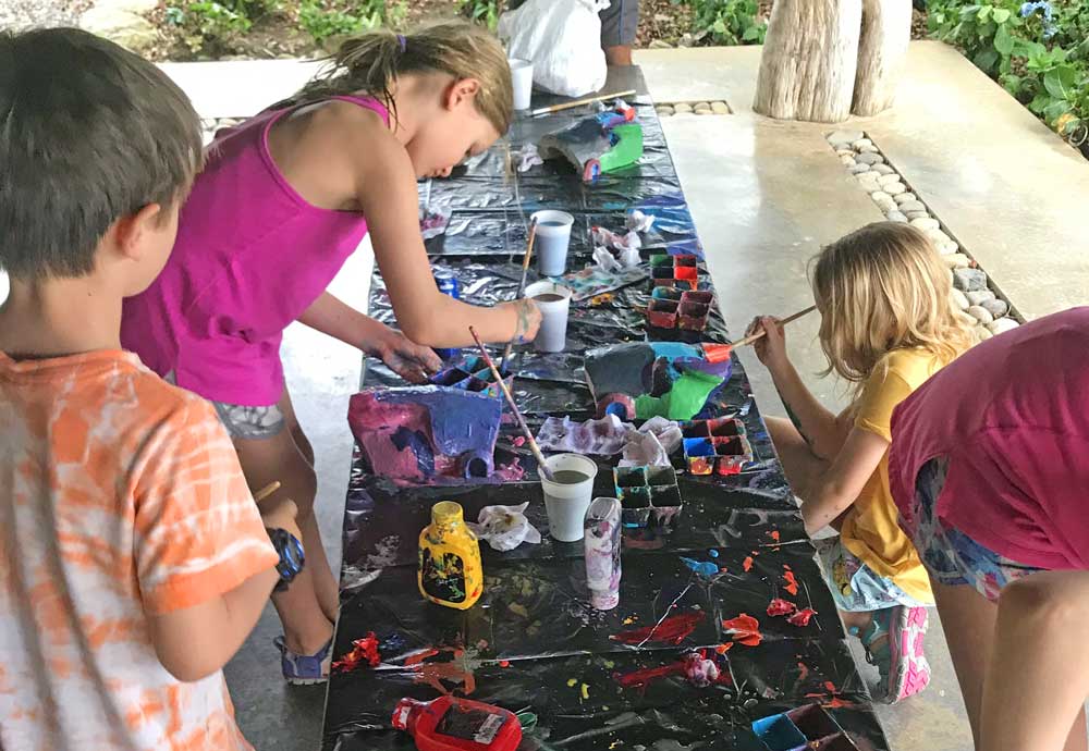 Painting balso wood masks in Costa Rica