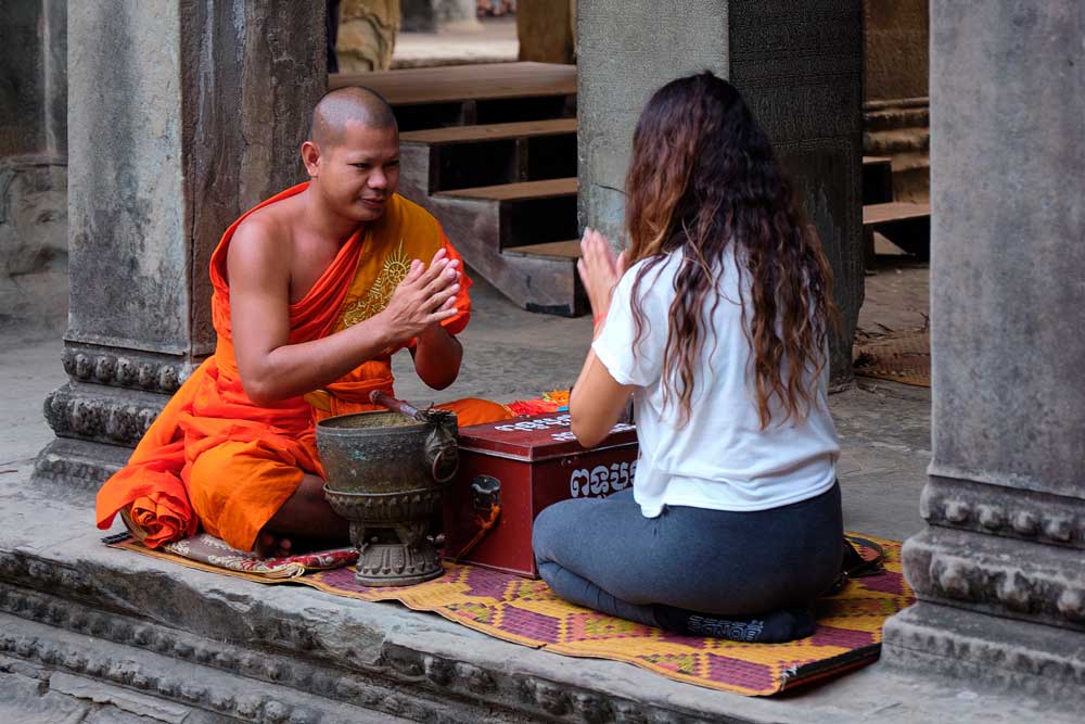 A backroads guest pays with a local in Vietnam