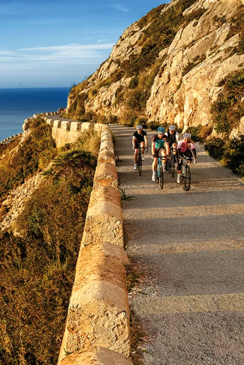 Group of bikers near a cliffside