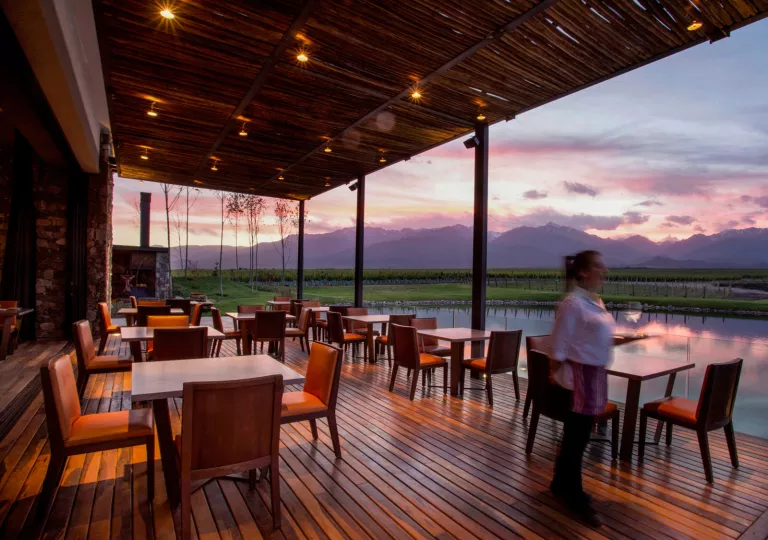 dining tables on patio at sunset