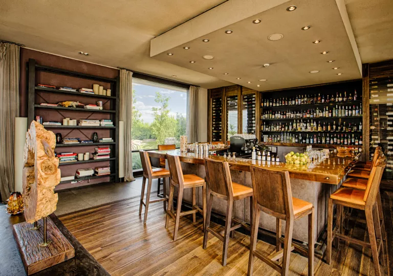 bar with shelves on wine bottles