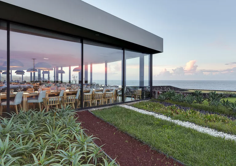 exterior of hotel with floor to ceiling windows