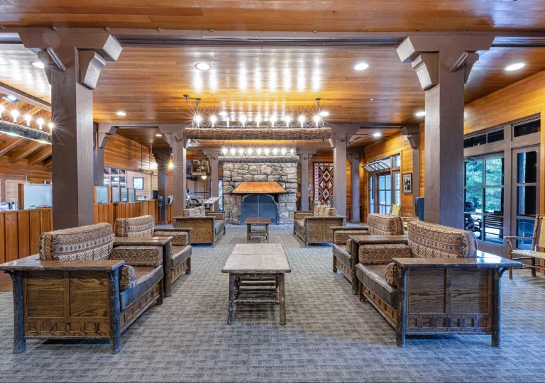 Indoor lobby with couches and furniture made of woode
