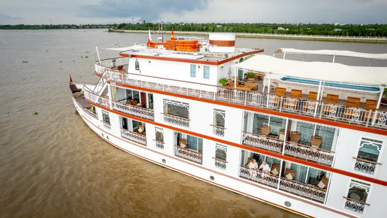 A boat gliding along a river