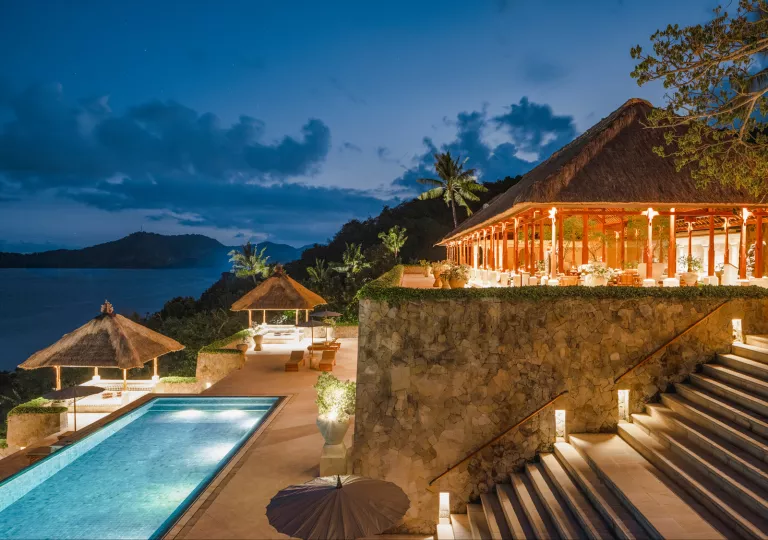 patio overlooking large pool during sunset