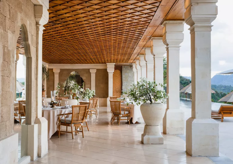 restaurant tables under a large covered patio