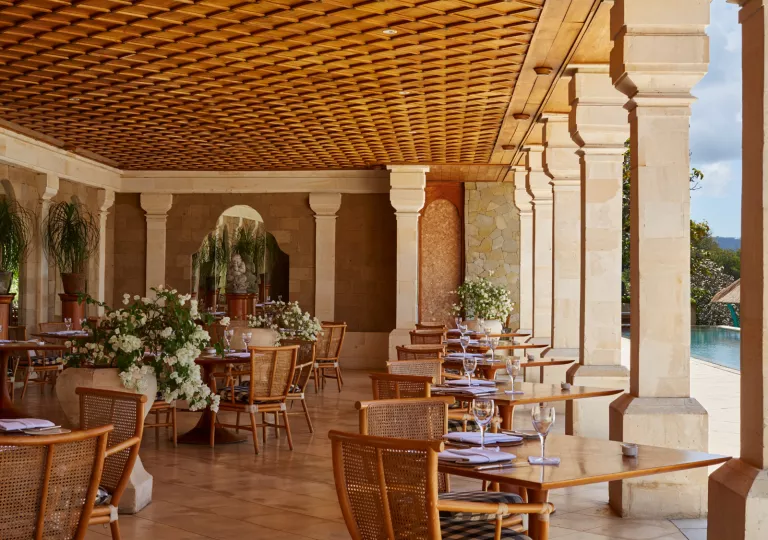 restaurant tables under a large covered patio