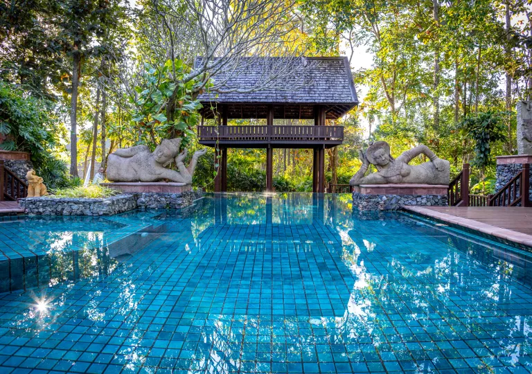 large swimming pool with statues