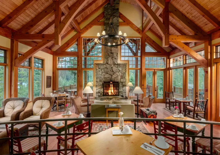 living room with exposed beams and fireplace