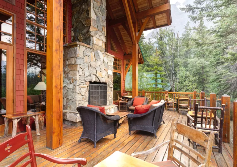 wooden deck with furniture and fireplace