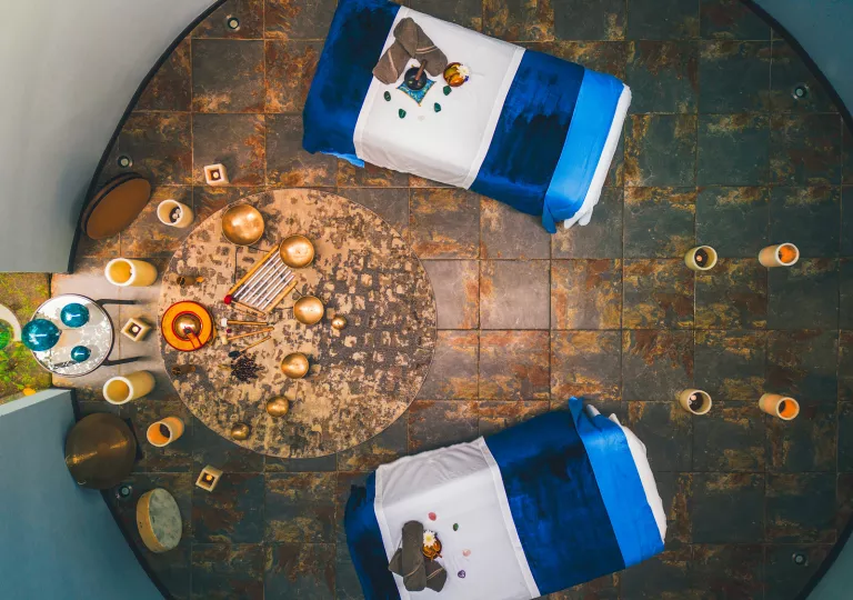 Top view of two massage beds in a circular room