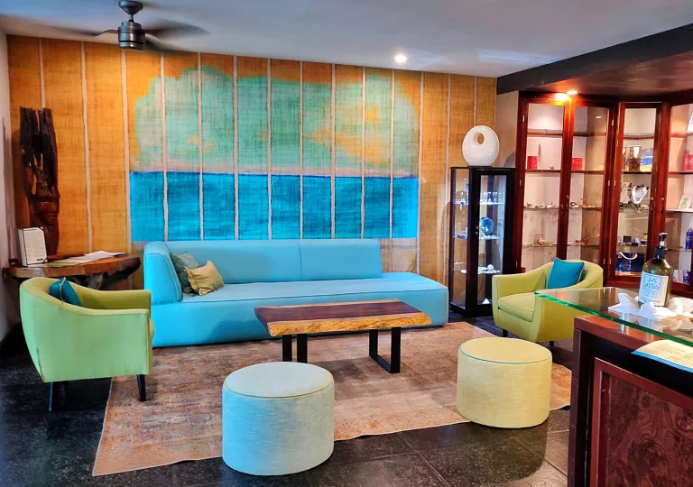 colorful hotel lobby with blue and green seating
