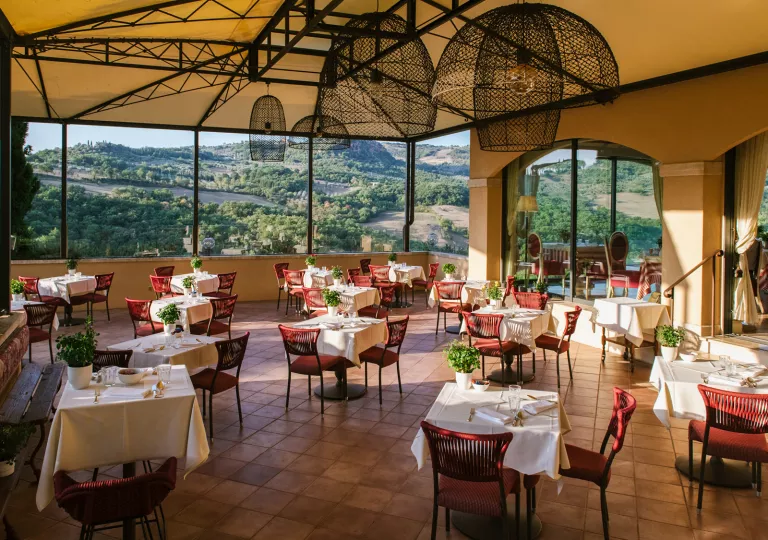 covered patio with bistro tables