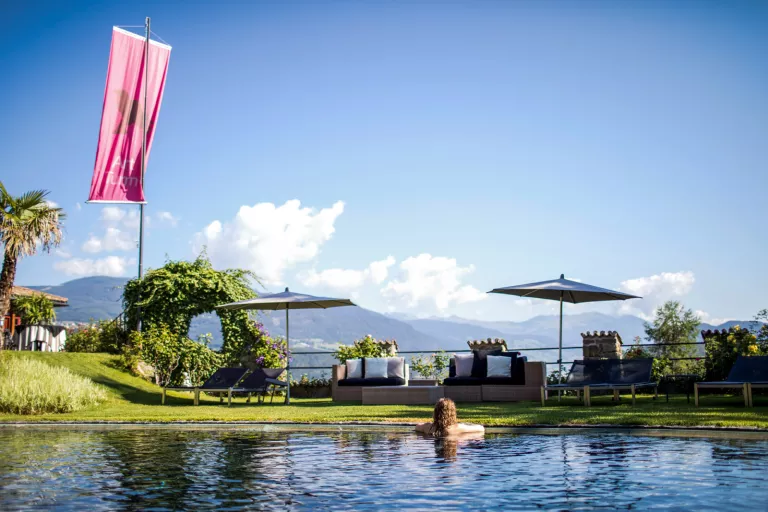 guest in a pool looking at the view