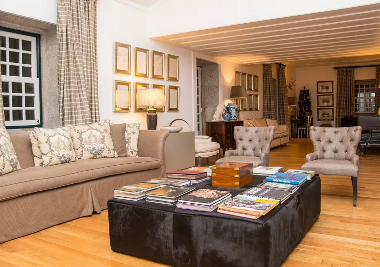 hotel lobby with couch and chairs around a coffee table