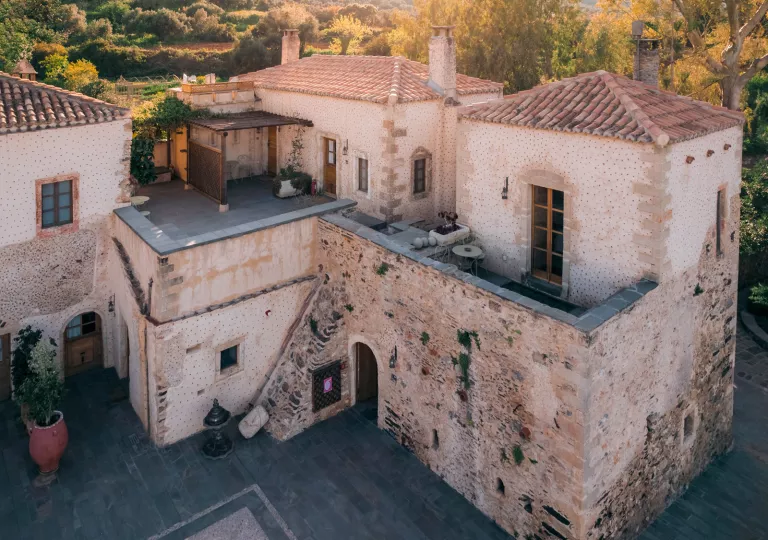 Stone two-story buildings with open courtyards below