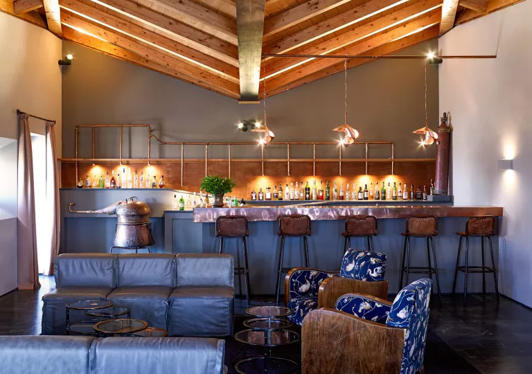 Bar with leather stools and copper accents