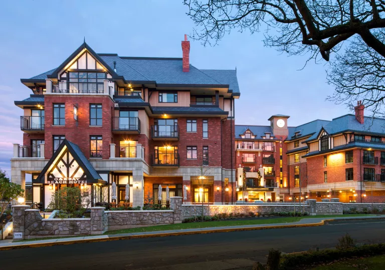 Oak Beach Hotel lit up at dusk