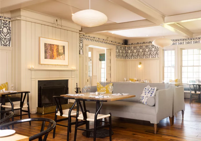 Lounge area with gray sofas in front of a fireplace