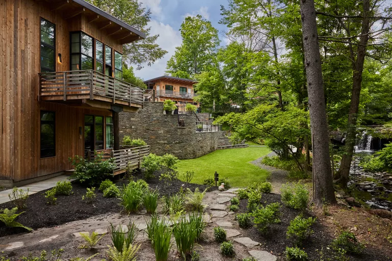 Outdoor courtyard oh building with trees and grass