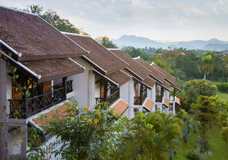 row of homes next to trees