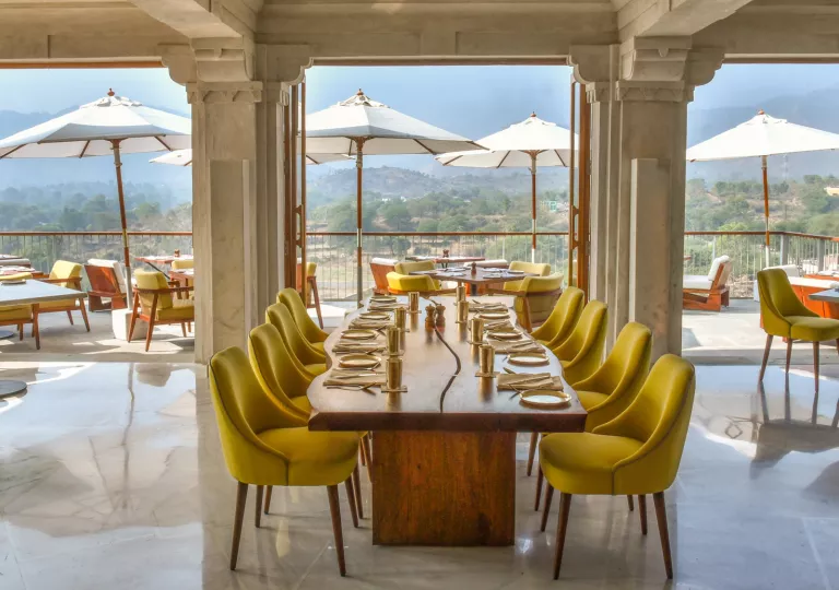 long dining table in open air dining room