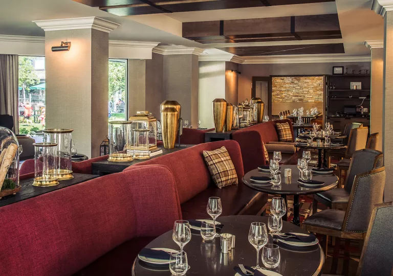 Dining hall with red couches and brown tables