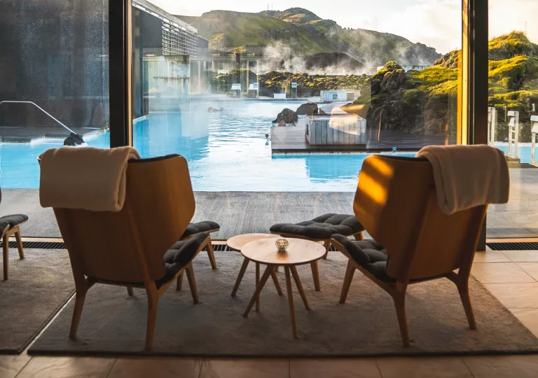 Chairs overlooking blue lagoon water