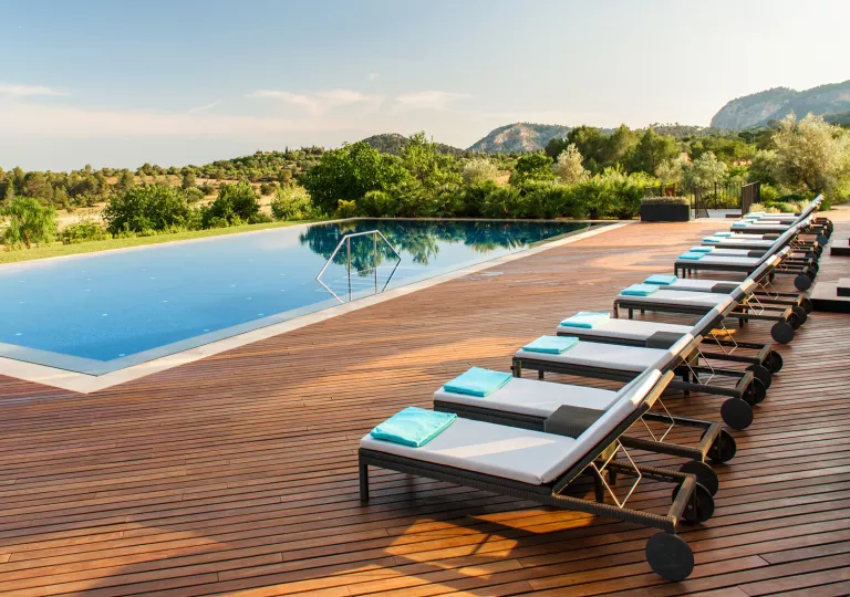 hotel pool with lounge chairs