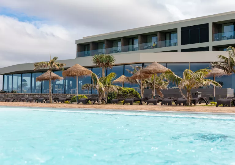 hotel pool with lounge chairs