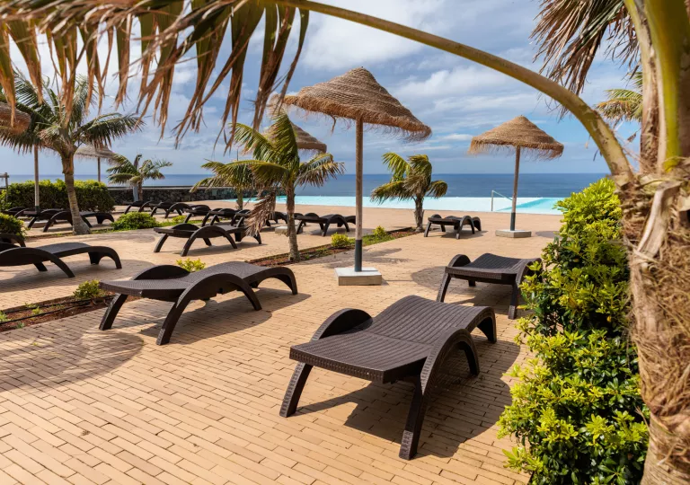 lounge chairs and umbrellas on the beach
