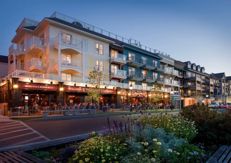 Hotel building with outdoor dining on the sidewalk