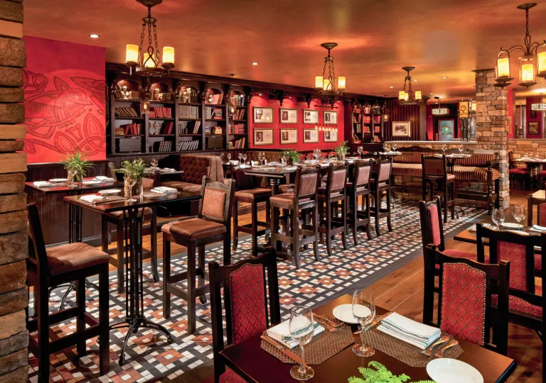 Indoor dining area with books on the walls