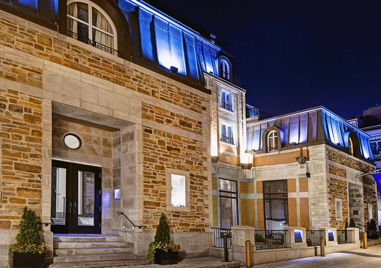 exterior of hotel lit at night