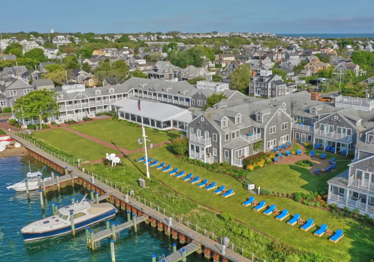 hotel property on a dock with boats in water