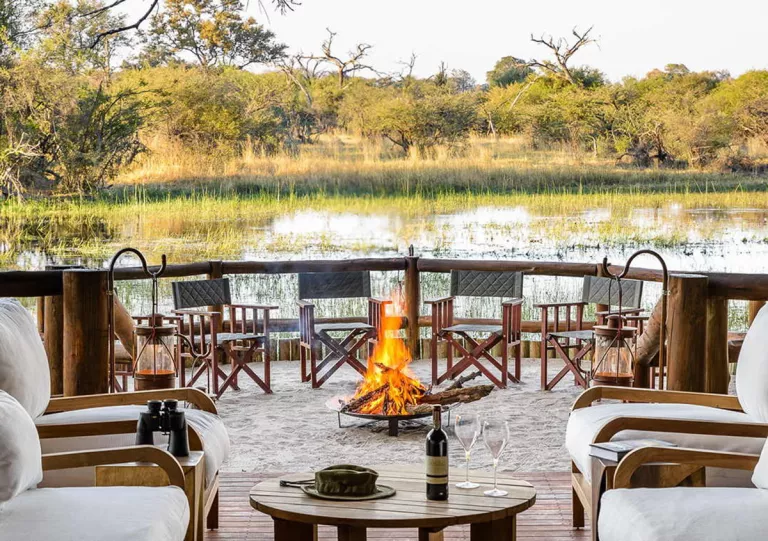 patio with firepit on a lake