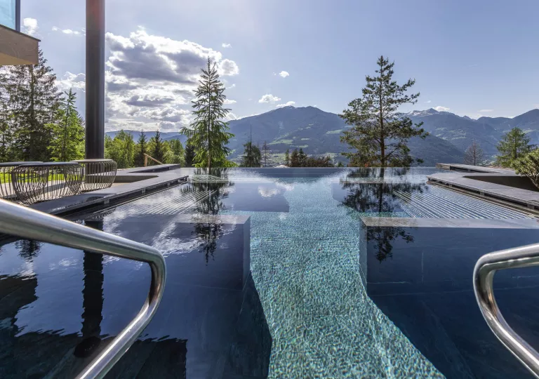 Outdoor infinity pool looking out towards the mountains
