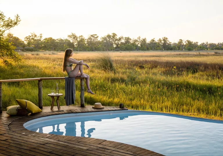 guest relaxing by the pool