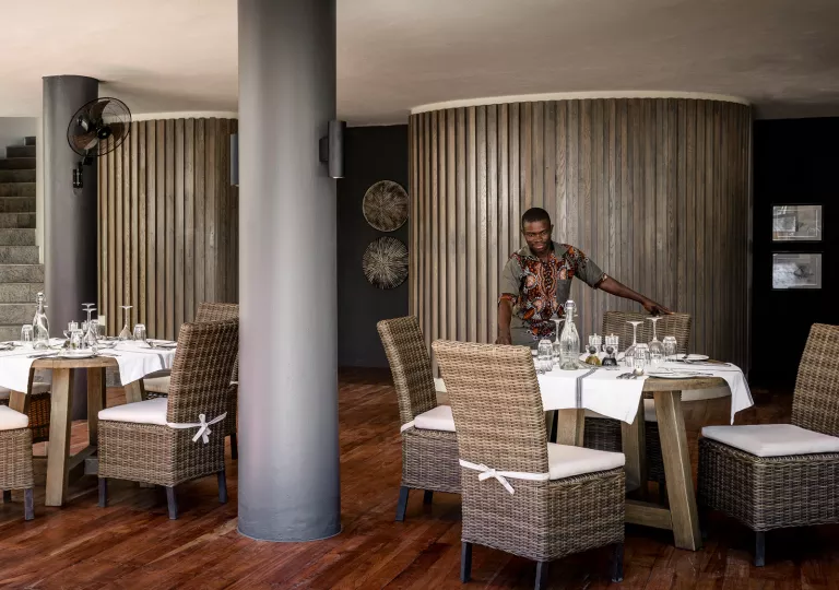 a man sets dining room table