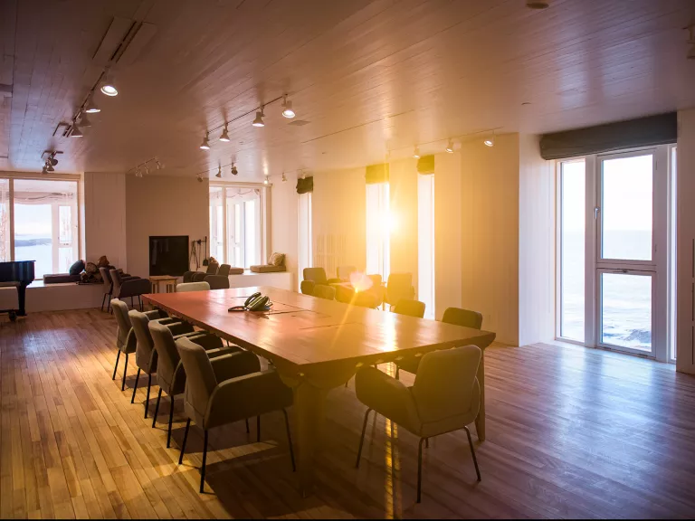 large dining room table in sunlit room
